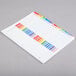 A white paper with colorful A-Z tabs.