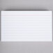 A white Universal ruled index card with black lines.