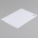 A white sheet of Universal 1" x 2 5/8" white labels with red writing on it.