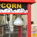 A Carnival King popcorn machine with a Carnival King 65 watt light bulb.