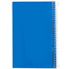 A close-up of a blue National College Rule 1 Subject spiral notebook.
