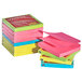 A stack of Universal Assorted Neon Color Fan-Folded Pop-Up Notes with pink, yellow, green, and blue post-its.