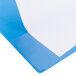 A light blue Universal Deluxe view binder with a white sheet of paper on the cover.