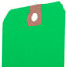 A green Avery shipping tag with a brown hole.