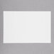 A white rectangle on a gray surface.