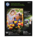 A box of HP Inc. glossy photo paper with 50 sheets.