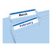 A white file folder with a blue label reading "February" and "March".