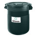 A black trash can with a white rectangular Avery label that says glass.