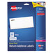 A blue box of white rectangular Avery return address labels with a black logo.