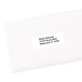 A white envelope with a white address label with black text.