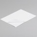 A white piece of paper with a curled corner on a white background.