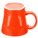 A red Fiesta tapered china mug with a white rim and handle.
