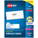 A blue box of white Avery Mailing Address Labels.