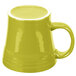 A yellow Fiesta china mug with a white rim and handle.