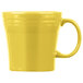 A yellow Fiesta tapered china mug with a handle.