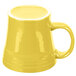 A yellow Fiesta mug with a handle.