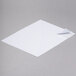 A white square paper with a curled corner.
