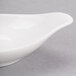 A white curved edge bowl with a pointy tip.