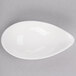 A white porcelain bowl with a small hole in it.