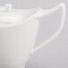 A white Royal Rideau porcelain teapot with a lid.
