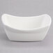A white rectangular porcelain bowl with a curved edge.