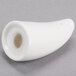 A close-up of a white porcelain pepper shaker with a hole in the end.