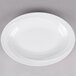 A white Reserve by Libbey narrow rim porcelain platter with a curved edge.