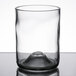 A clear Arcoroc wine tumbler with a hole in the middle.