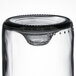 A close up of a clear Arcoroc wine tumbler on a table.