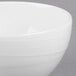 A close-up of a white Reserve by Libbey Royal Rideau bowl with a wavy design.