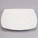 A white square porcelain plate with a wide rim.