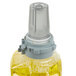 A GOJO ADX bottle filled with yellow Citrus Ginger hand and showerwash.