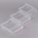 A group of three clear plastic Edlund scale covers.