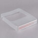 A clear plastic container with a red label for Edlund ClearShield protective scale covers.