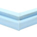 A close up of a blue plastic corner on a white object.