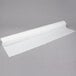 A roll of white paper on a gray background.