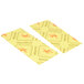 Two yellow Spilfyter absorbent pads with orange and yellow designs on a counter.