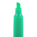 A green Universal highlighter pen with a white cap and pocket clip.