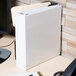 A white Avery heavy-duty view binder with papers in it.