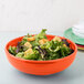 A Fiesta china bistro bowl filled with salad and croutons.