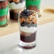 Blueberry yogurt parfaits in Acopa Pub Beer Tasting glasses with toppings on a table.