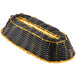 A black and gold woven rattan cracker basket with a handle.