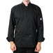A man wearing a black Mercer Culinary long sleeve chef jacket.