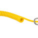 A yellow coiled cable with a metal ring.
