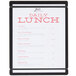 A black menu board with white paper and black bands.