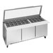 A Beverage-Air stainless steel refrigerated sandwich prep table with three glass lids open.