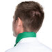 The back of a man wearing a green Intedge chef neckerchief with white polka dots.