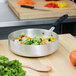 A Vollrath Wear-Ever saute pan with broccoli, tomatoes, and green leafy vegetables.