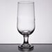 A close-up of a Libbey stemmed pilsner glass with a small rim.