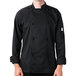 A man wearing a black Mercer Culinary long sleeve chef jacket.